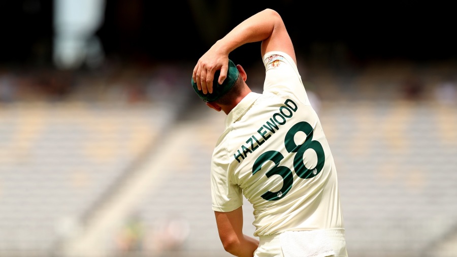 PERTH, AUSTRALIA - DECEMBER 04: Josh Hazlewood of Australia stretches during day five of the First Test match between Australia and the West Indies at Optus Stadium on December 04, 2022 in Perth, Australia. (Photo by Will Russell - CA/Cricket Australia via Getty Images)