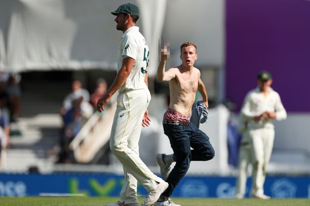 Topless pitch invader halts Ashes Test as yob pelted with pint after swearing at Aussies