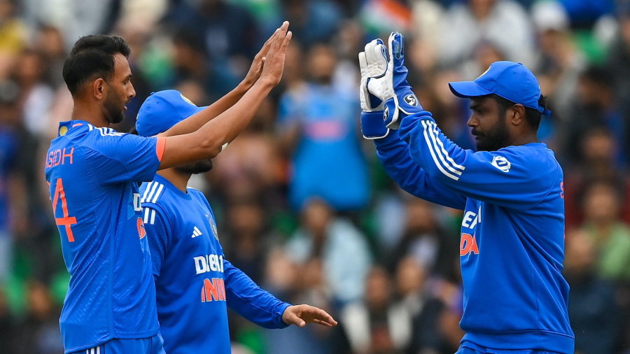 Dublin , Ireland - 18 August 2023; India bowler Prasidh Krishna, left, is congratulated by teammate Sanju Samson after claiming the wicket of Ireland's Harry Tector during match one of the Men's T20 International series between Ireland and India at Malahide Cricket Ground in Dublin. (Photo By Seb Daly/Sportsfile via Getty Images)