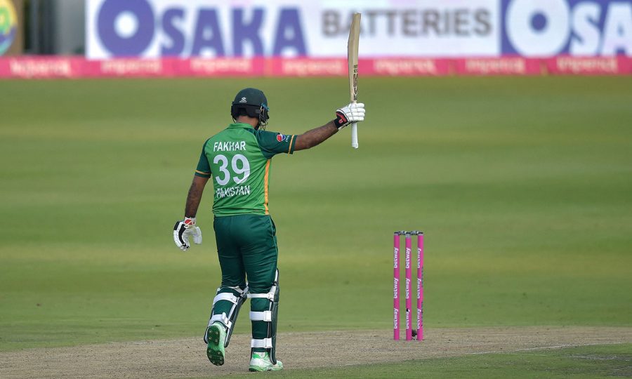 Pakistan's Fakhar Zaman celebrates after scoring a century (100 runs) during the second one-day international (ODI) cricket match between South Africa and Pakistan at Wanderers Stadium in Johannesburg on April 4, 2021. - The South African team's kit and the wickets are pink to raise awareness for breast cancer. (Photo by Christiaan Kotze / AFP) (Photo by CHRISTIAAN KOTZE/AFP via Getty Images)