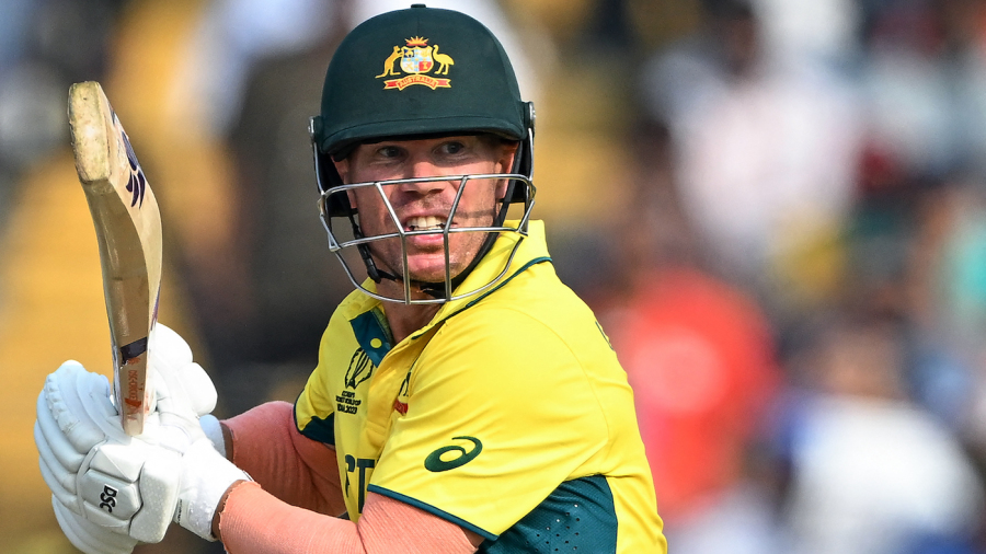 Australia's David Warner watches the ball after playing a shot during the 2023 ICC Men's Cricket World Cup one-day international (ODI) match between Australia and Bangladesh at the Maharashtra Cricket Association Stadium in Pune on November 11, 2023. (Photo by Punit PARANJPE / AFP) / -- IMAGE RESTRICTED TO EDITORIAL USE - STRICTLY NO COMMERCIAL USE -- (Photo by PUNIT PARANJPE/AFP via Getty Images)